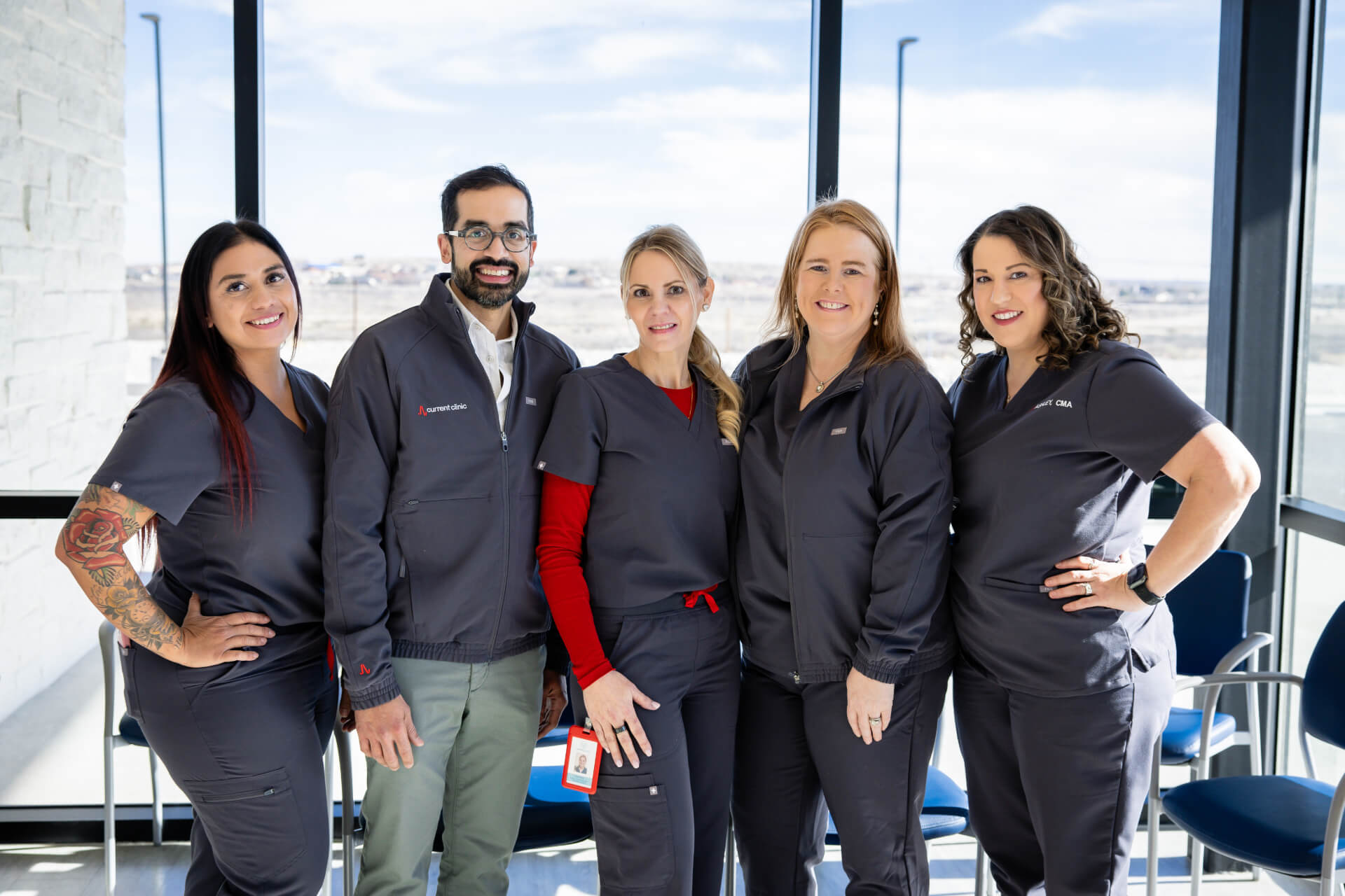 Current Clinic arrhythmia care team standing together in the clinic lobby